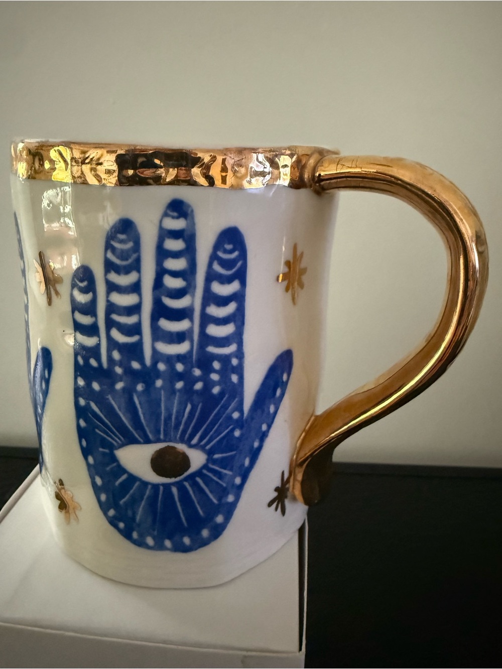 Anthropologie Coffee Mug Hamsa Blue Hands
Handpainted Gold trim, 4"